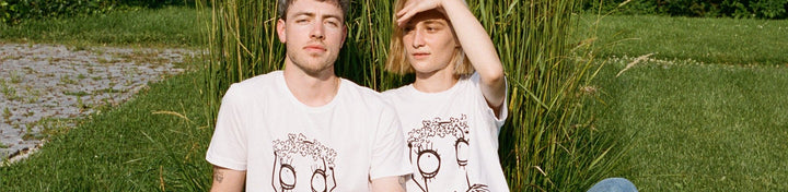 Man and woman with white Quipster T-shirt in nature